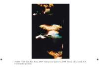 In the middle of the page, a photograph shows light streaks against a dark background. The image description appears underneath, in black. It is marked as 