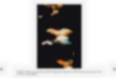 In the middle of the page, a photograph shows light streaks against a dark background. The image description appears underneath, in black. It is marked as 