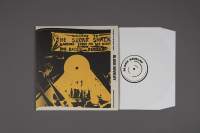 Grey background with album cover on top. The cover is black with some yellow elements. At the top, there is a yellow banner with text in black. 