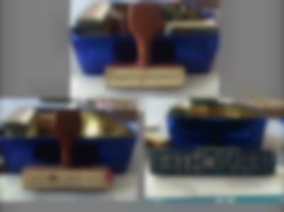 On top of a grey background, three different photographs show three different stamps in front of the same blue box. The stamp at the top reads 