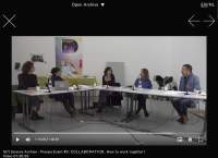 Video player on top of a black background. There is an X on the top left corner of the page and two arrows in opposite directions on the right. Inside the video player, the visible still shows five people sitting around a L shape table. They each have a microphone in front of them.