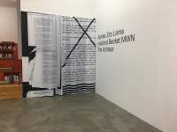 Curtain printed with a montage of several word documents. There is a large cross on top of the image occupying the right half of the curtain. On the wall, next to it, a black text reads: 